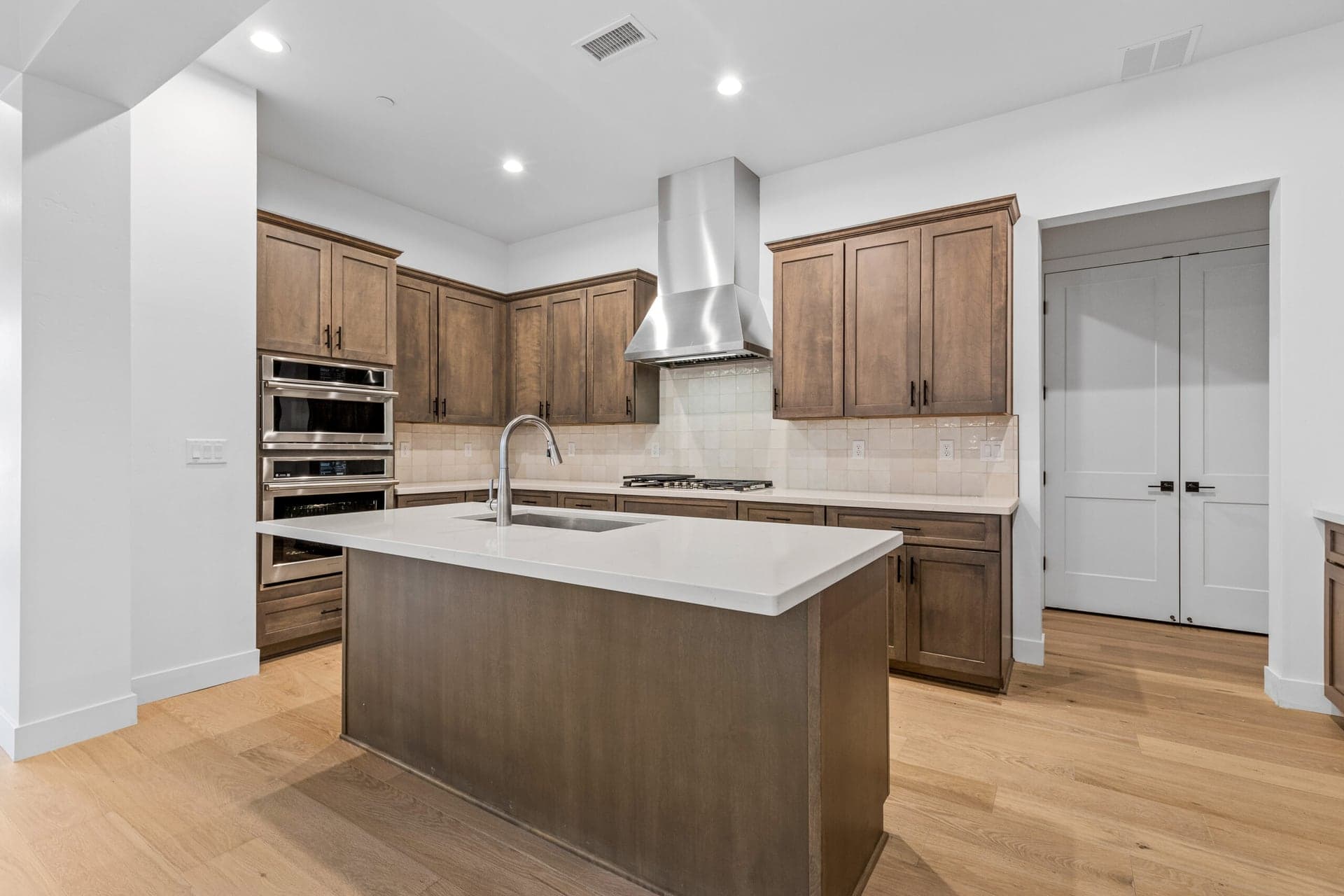 Modern kitchen with large island in a new construction home